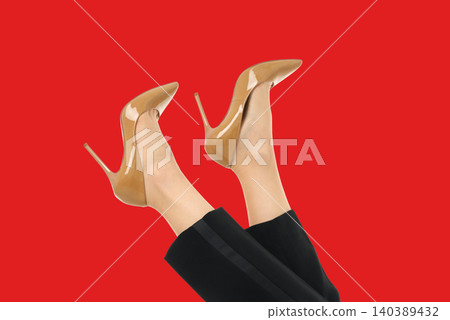 Woman showcases her stylish heels in a colorful setting Woman showcases her stylish heels in a colorful setting 140389432