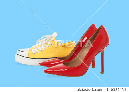 Two pairs of shoes are presented on a bright background Two pairs of shoes are presented on a bright background 140389434
