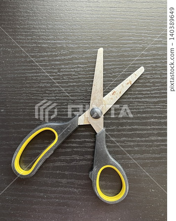 Wide Open Rusted Utility Scissors On Dark Wood Table Wide Open Rusted Utility Scissors On Dark Wood Table 140389649