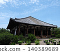 A quintessential Japanese scene, woven from treasured architecture and seasonal plants. The main hall of Gangoji Temple under a refreshing blue sky. 140389689