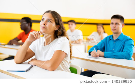 Group of people studying together at table. Focus on euroepan woman Group of people studying together at table. Focus on euroepan woman 140389930