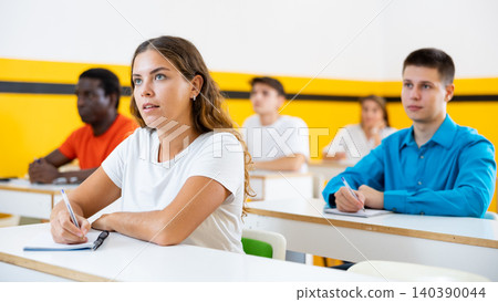 Young woman attending lecture in taxi training school Young woman attending lecture in taxi training school 140390044