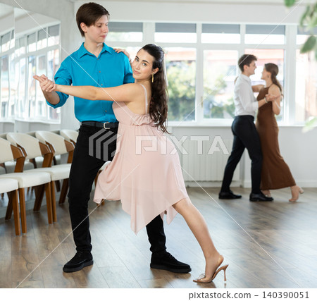 Couple young woman and man dancing tango Couple young woman and man dancing tango 140390051