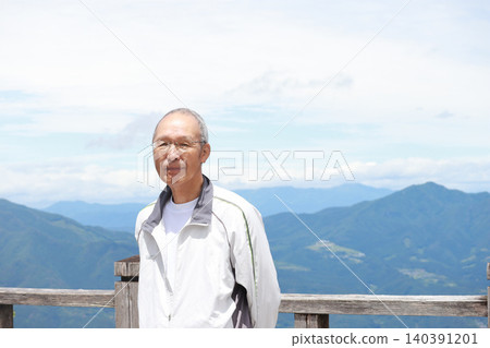 Senior man looking at the mountains Senior man looking at the mountains 140391201