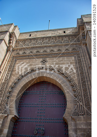 Large stone-carved arch of the Mahkama du Pacha reflecting Andalusian Arab art in Casablanca, Morocco Large stone-carved arch of the Mahkama du Pacha reflecting Andalusian Arab art in Casablanca, Morocco 140391529