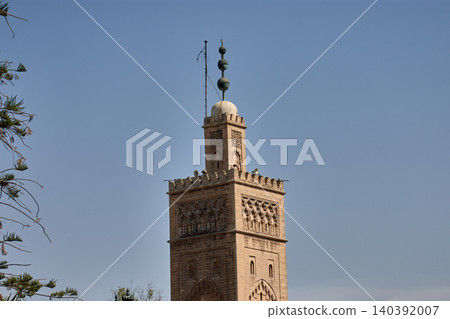 View of the clay minaret of the Moulay Youssef Mosque in Casablanca's historic Habous Quarter. View of the clay minaret of the Moulay Youssef Mosque in Casablanca's historic Habous Quarter. 140392007