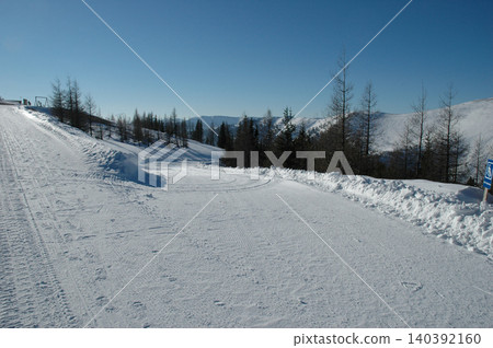 Groomed ski trail on Brunnachhoehe mountain in winter Groomed ski trail on Brunnachhoehe mountain in winter 140392160