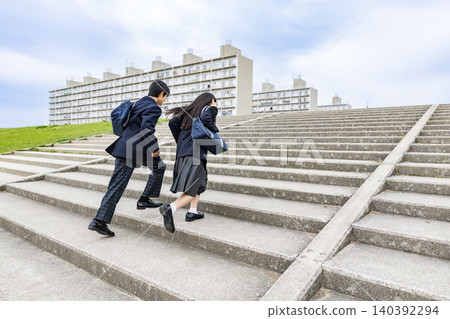 Middle school students climbing the stairs Middle school students climbing the stairs 140392294