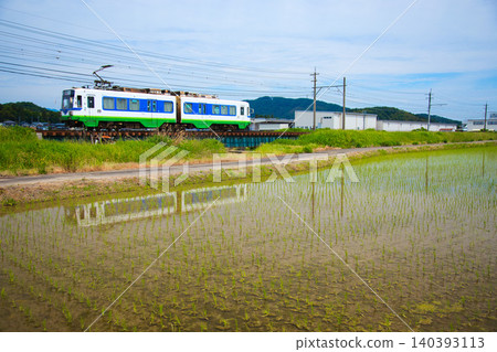 The Fukutetsu Fukubu Line runs through a rural area where rice planting has begun. The Fukutetsu Fukubu Line runs through a rural area where rice planting has begun. 140393113