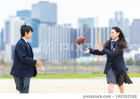 Middle school student running with a rugby ball Middle school student running with a rugby ball 140393598