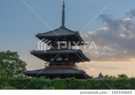 A photograph of the warming rice paddies reflecting Hokiji Temple, a scene from early summer in Ikaruga. A photograph of the warming rice paddies reflecting Hokiji Temple, a scene from early summer in Ikaruga. 140394069