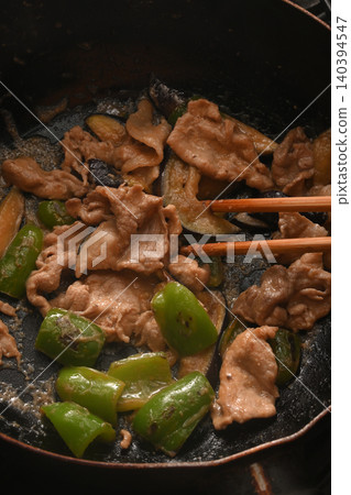 Stir-fried eggplant, green pepper, and pork with miso while cooking Stir-fried eggplant, green pepper, and pork with miso while cooking 140394547