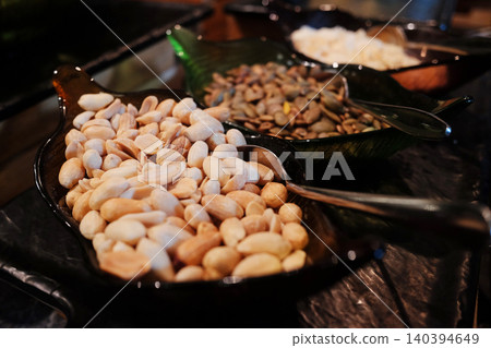 Close up peanuts is snack in black plate Close up peanuts is snack in black plate 140394649