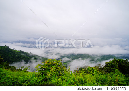 Landscape high mountains with mist and foggy cloud on valley hill with greenery forest in Thailand Landscape high mountains with mist and foggy cloud on valley hill with greenery forest in Thailand 140394653