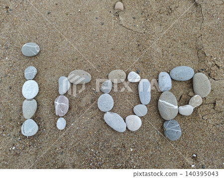 Pebbles on the sand near the sea Pebbles on the sand near the sea 140395043