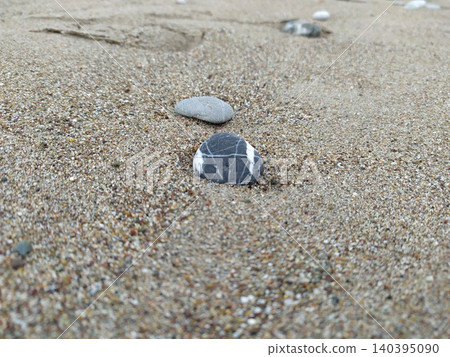Pebbles on the sand near the sea Pebbles on the sand near the sea 140395090