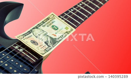 Ten dollars bill banknote on rock electric guitar,red gradient Ten dollars bill banknote on rock electric guitar,red gradient 140395289