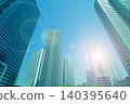 Skyscrapers and the shining sun 140395640