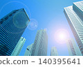 Skyscrapers and the shining sun 140395641