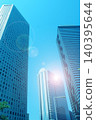 Skyscrapers and the shining sun 140395644