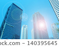Skyscrapers and the shining sun 140395645
