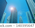 Skyscrapers and the shining sun 140395647