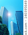 Skyscrapers and the shining sun 140395649