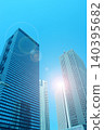 Skyscrapers and the shining sun 140395682