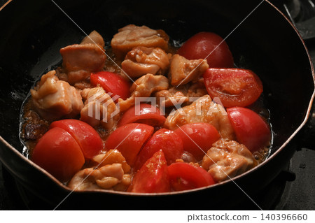 Chicken and Tomato: A scene of chicken and tomatoes being stir-fried. Chicken and Tomato: A scene of chicken and tomatoes being stir-fried. 140396660