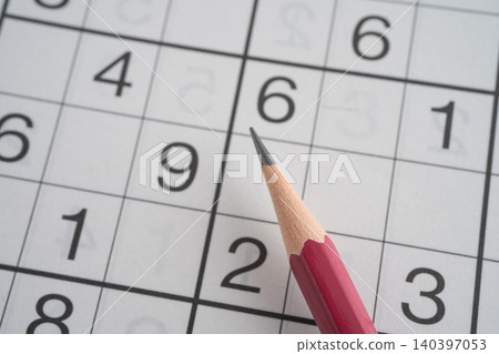 Sudoku puzzle game playing to challenge brain. Sudoku puzzle game playing to challenge brain. 140397053