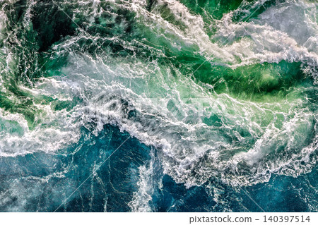 Blue waves of water of the river and the sea meet each other during high tide and low tide. Blue waves of water of the river and the sea meet each other during high tide and low tide. 140397514