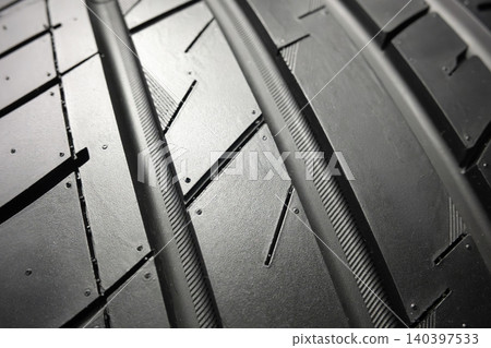 Black tire tread texture background with detailed rubber pattern. Black tire tread texture background with detailed rubber pattern. 140397533