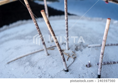 Burning incense sticks on Miyajima Island in Hiroshima, Japan 140397560