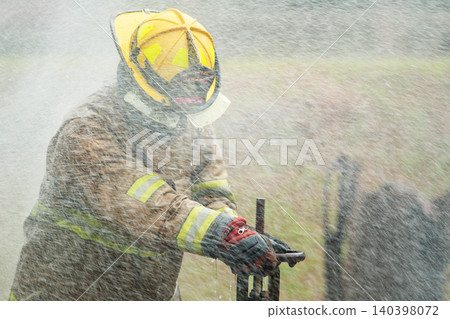Firefighter Hands Turning Water Valve in Action 140398072