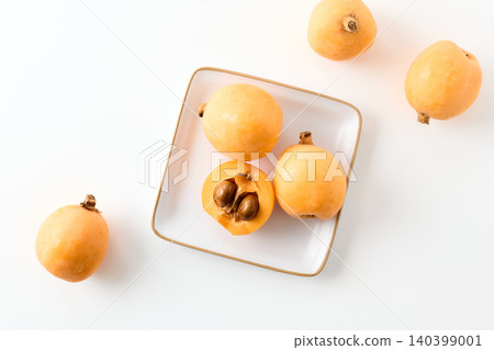 Loquats arranged on a plate Loquats arranged on a plate 140399001