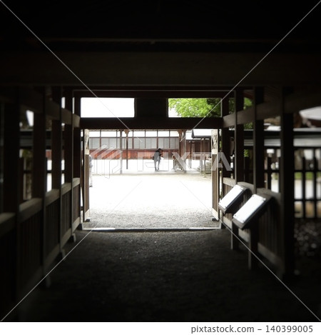 A corridor overlooking the shrine grounds, with interplay of light and shadow; a framed composition; square. A corridor overlooking the shrine grounds, with interplay of light and shadow; a framed composition; square. 140399005