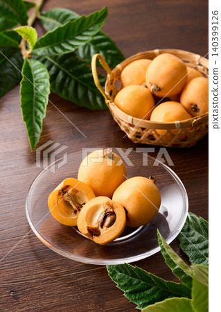 Loquats arranged on a plate 140399126