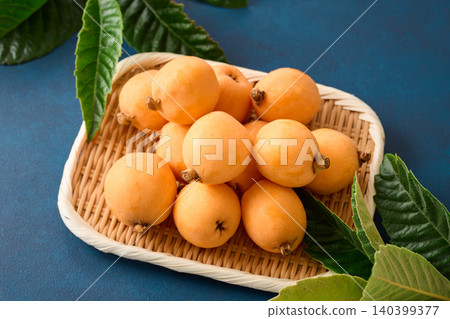 Loquats served in a basket Loquats served in a basket 140399377