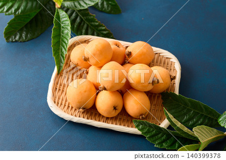Loquats served in a basket Loquats served in a basket 140399378