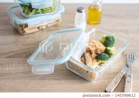 Healthy meal prep containers with salmon, chicken, pasta and fresh vegetables 140399612