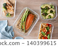 Healthy meal prep containers with salmon, chicken, pasta and fresh vegetables 140399615