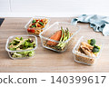 Healthy meal prep containers with salmon, chicken, pasta and fresh vegetables 140399617