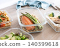 Healthy meal prep containers with salmon, chicken, pasta and fresh vegetables 140399618
