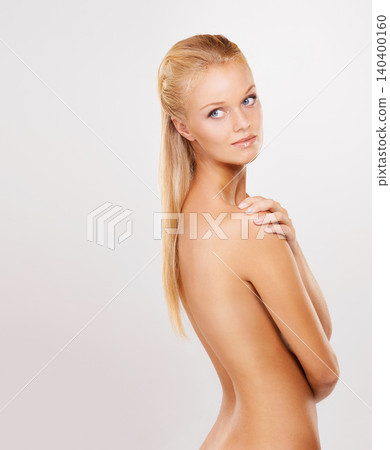 Body care, beauty and young woman in studio for health, wellness and skin routine. Confident, glow and female person from Canada with dermatology treatment by white background with mockup space. 140400160