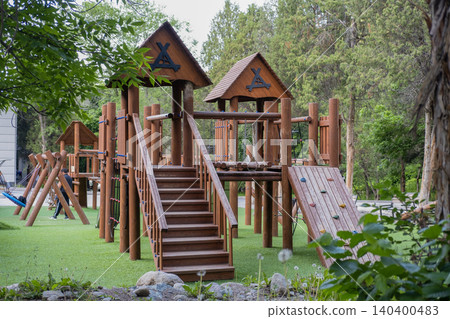 Outdoor kids playground made of natural logs with stairs and bridges. Kyrgyzstan Issyk-Ata June 10, 2026 Outdoor kids playground made of natural logs with stairs and bridges. Kyrgyzstan Issyk-Ata June 10, 2026 140400483