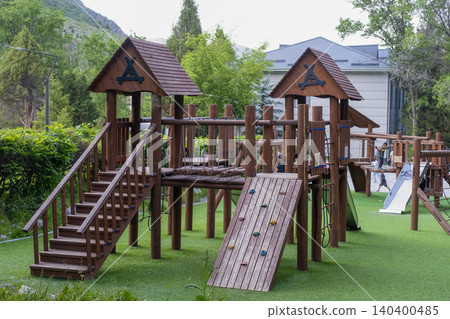 Outdoor kids playground made of natural logs with stairs and bridges. Kyrgyzstan Issyk-Ata June 10, 2026 140400485