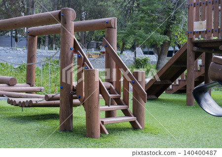 Outdoor kids playground made of natural logs with stairs and bridges. Kyrgyzstan Issyk-Ata June 10, 2026 Outdoor kids playground made of natural logs with stairs and bridges. Kyrgyzstan Issyk-Ata June 10, 2026 140400487