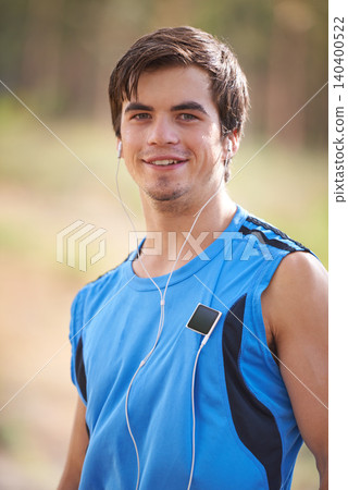 Music player, portrait or or happy man running with earphones in outdoor exercise or fitness workout. Runner, nature or athlete listening to playlist for streaming radio, podcast or sports training Music player, portrait or or happy man running with earphones in outdoor exercise or fitness workout. Runner, nature or athlete listening to playlist for streaming radio, podcast or sports training 140400522