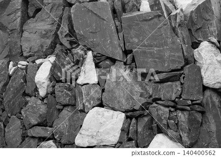 Ancient masonry wall built with natural gray river stones Ancient masonry wall built with natural gray river stones 140400562