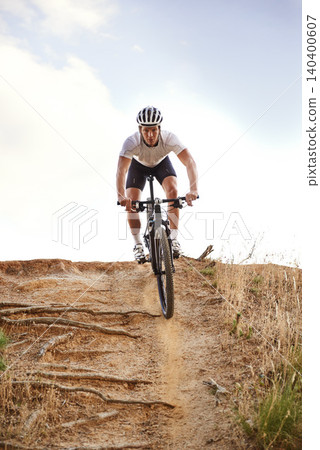 Portrait, bike and man off road cycling on dirt track for sports, competition or outdoor hobby. Fitness, nature and race with confident young athlete or cyclist in helmet for cardio performance Portrait, bike and man off road cycling on dirt track for sports, competition or outdoor hobby. Fitness, nature and race with confident young athlete or cyclist in helmet for cardio performance 140400607